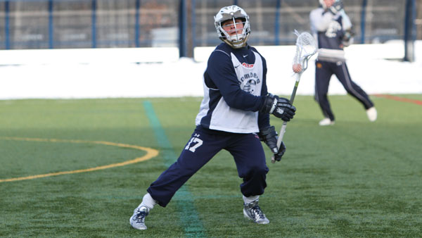 Junior midfielder Matt Greenblatt catches the ball in his stick during the men’s lacrosse team’s practice Feb. 17 at Higgins Stadium. Greenblatt was second on the team with 64 faceoff wins.