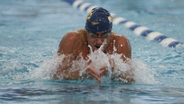 Sophomore Jon Yoskin swims the breaststroke in the men’s swimming and diving team’s meet Feb. 1 in the Athletics and Events Center Pavilion. The Blue and Gold defeated Union College 194–106.