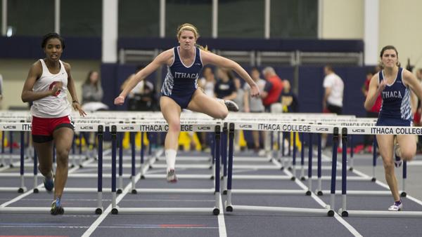 Sophomore Allie Nugent clears a hurdle at the Bomber Quad Meet on Feb. 7 in Glazer Arena.