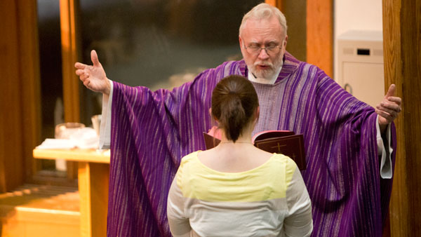 The Rev. Carsten Martensen, Catholic chaplain and director at Ithaca College and Cornell University, delivers a message to the congregation at Catholic Mass at 8 p.m. March 16 in Muller Chapel.