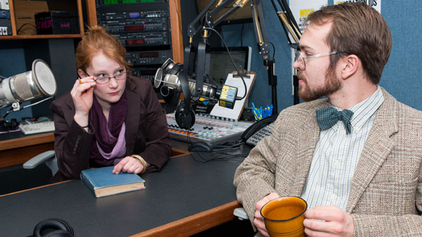 Radio host Teri (freshman Lily Waldron) speaks with Dr. Palinurus (junior Nathaniel Fishburn) in Ithaca College Main Stage Theater’s production, “Gone Missing,” running until April 5.