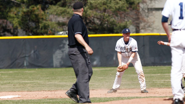 Sophomore shortstop Stephen Yanchus flips the ball out of his mitt during the baseball team’s doubleheader against Utica College on April 12 on Freeman Field. Yanchus is currently hitting .304 with nine stolen bases.