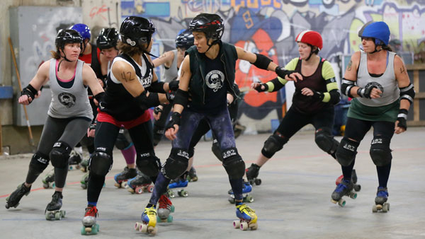 Veronica Frosen, lecturer of legal studies at Ithaca College, skates in front of her teammates during a team practice April 24 in Lansing, N.Y.