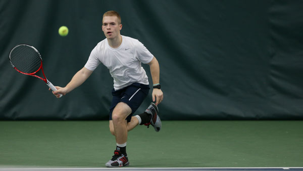 Senior David Andersen charges toward the ball March 29 in Cornell University’s Reis Tennis Center.