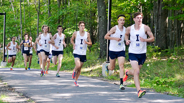 From left, junior Sawyer Hitchcock, Dan Craighead ’12 and sophomore Sean Phillips of the men’s cross-country team compete in the Jannette Bonrouhi-Zakiam Memorial Alumni Run on Aug. 30.