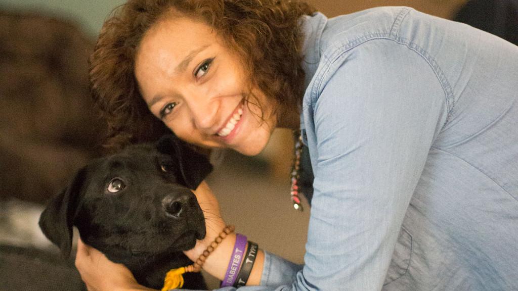 Senior Shanika Bridges is the first student to receive an on-campus diabetic alert service dog, Tobbi. 