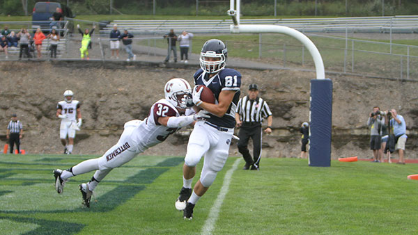 From left, Union College junior defensive back  Ricardo Fonseca attempts to tackle sophomore wide receiver Andrew Tabbert in the endzone during the football team’s 21–16 win over the Pioneers on Sept. 6 at Butterfield Stadium.