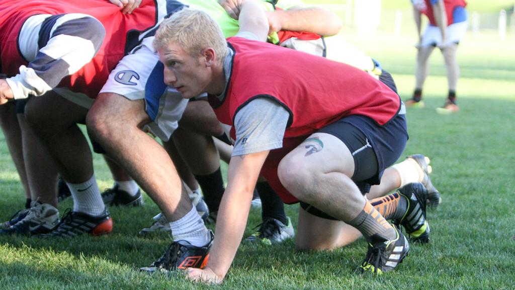 Senior forward Matthew Clum takes part in a scrum during the club rugby team’s practice on Sept. 19 at Yavits Field. 