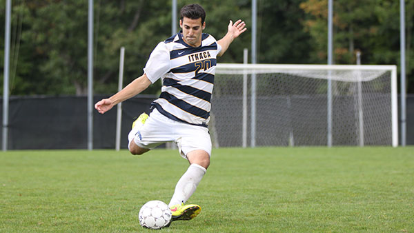 Senior midfielder Brandon Glass kicks the ball during the men’s soccer team’s 1–1 draw over SUNY Geneseo on Sept. 13 at Carp Wood Field. The Bombers are 0–3–1 to begin the season.  