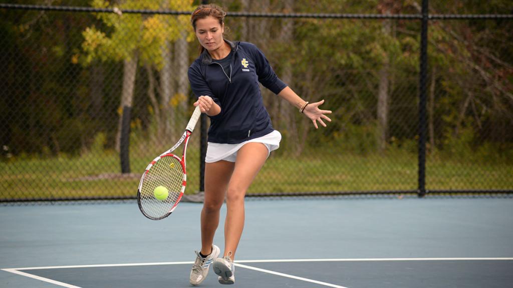 Sophomore Haley Kusak hits a forehand during the women’s tennis team’s matchup with Houghton College on Sept. 20. The Bombers won all nine matches and are 5–0 on the season. 