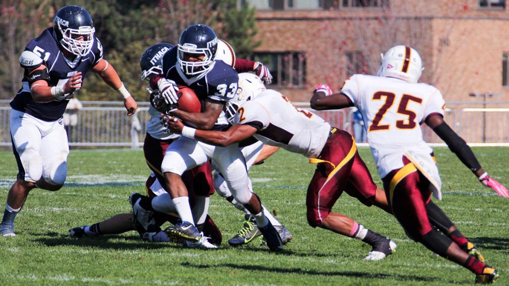 Freshman running back Tristan Brown runs with the ball while a Salisbury University defender tackles him during the football teams 32–7 win over the Sea Gulls on Oct. 25 at Butterfield Stadium. 