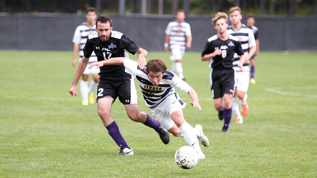 From right, sophomore forward Sean Forward battles Alfred University junior Dylan Smith in the Bombers’ 3–1 win on Sept. 20 at Carp Wood Field. Forward contributed an assist in the game and has four goals on the year.