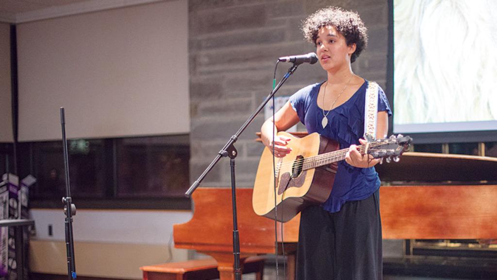 Sophomore Jordan Shoemaker performs at Open Mic Night on Oct. 1 in Clark Lounge. Open Mic Night alternates between IC Square and Clark Lounge, and attendance has risen since last year.