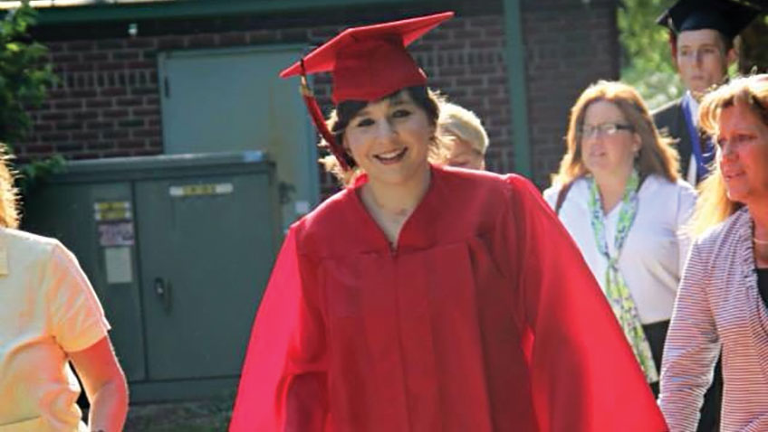 Katelyn Elliott, the subject of sophomore Hannah Bascianos documentary, walks after her high school graduation. Bascianos film follows Elliotts recovery after a severe car accident. 