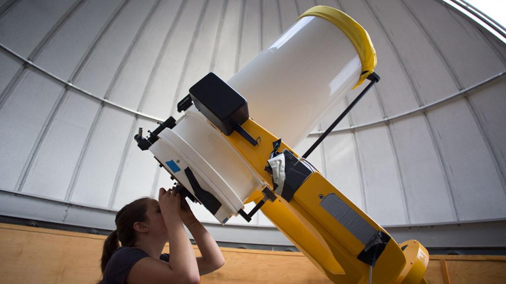 Sophomore physics major Amy Parker looks through the telescope at the Ford Observatory on Oct. 7. The observatory  is open to the public for viewings and tours 8–9 p.m. Friday nights throughout each academic semester.
