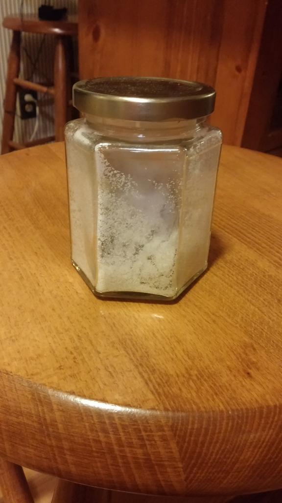 A jar of silica sand used for hydraulic fracturing