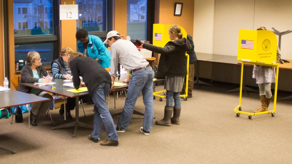 Students and local residents sign in to vote at the Circles Community Center. New York residents cast votes for governor and congressional representatives in the Nov. 4 midterm elections.