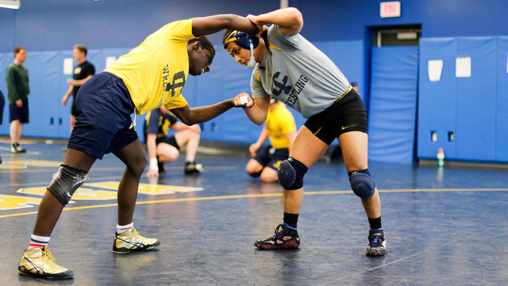 From right, senior Alex Gomez grapples with junior Henry Beaman during the wrestling team’s practice in March in Hill Center. Gomez placed first in the NCAA Northeast Regional last season.   