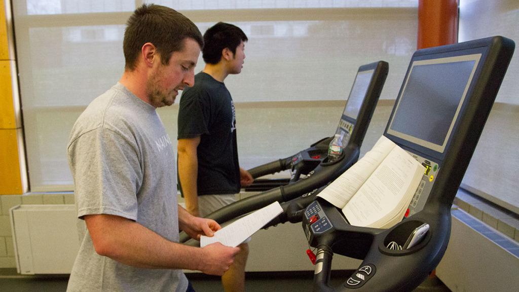 Senior Spencer Bailey studies calculus while walking on the treadmill in the Fitness Center on Nov. 11. Eight years ago, Bailey was in a drunk-driving car accident that changed his life. 