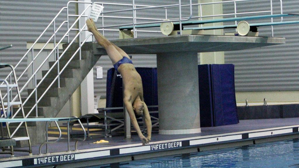Senior Matt Morrison works on a dive off the low board during the team’s practice on Nov. 10. Morrison is the only male diver for the Bombers and has already recorded several first-place finishes this year. 