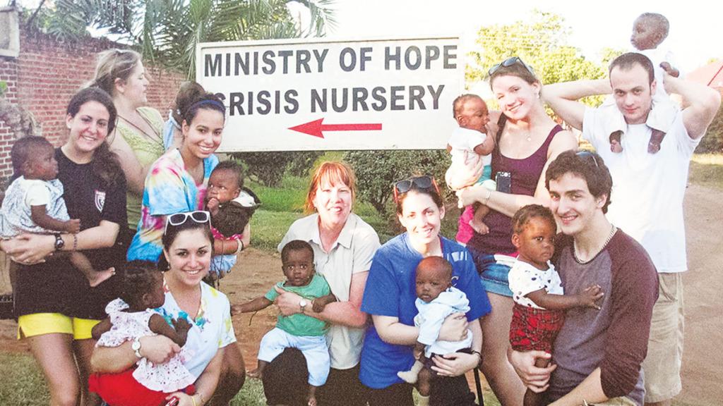 Students from Ithaca College hold babies from the Ministry of Hope crisis care nursery in Lilongwe, Malawi. The nursery provides care and nutrition fror the children until they’re old enough to return to their families.