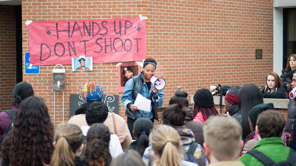 Kayla Young spoke at the “Hands Up Walk Out” demonstration on Dec. 1. She wants the college to restructure the Native American Studies minor, which ties into understanding structural violence.