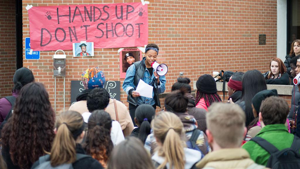 Ithaca College students gather together on Dec. 1 at Free Speech Rock outside of Campus Center in a student-organized Hands Up Walk Out rally. 