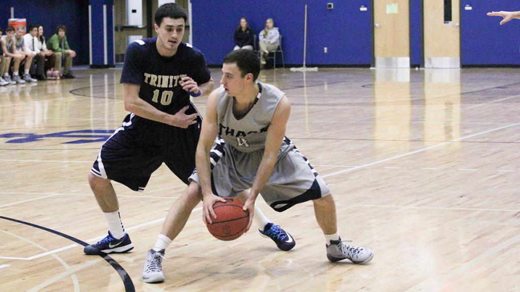 Senior Max Mascucci looks for an open teammate in the men’s basketball team’s 74–48 loss to  Trinity College Nov. 21. Mascucci hit two threes in the game to account for his six points off the bench. 