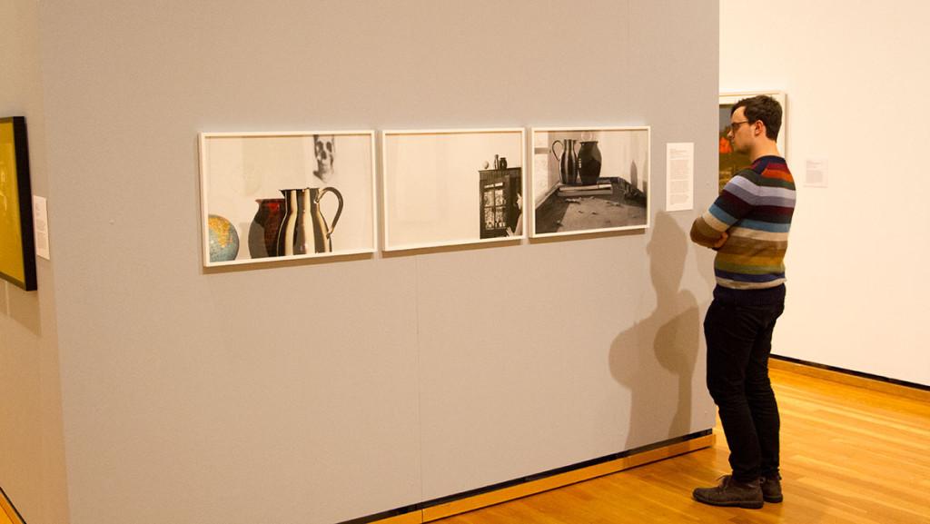 Piotr Pillary studies a triptych from Barbara Prosts’ “Exposures” as part of the “Staged, Performed, Manipulated” exhibit at the Johnson Museum.