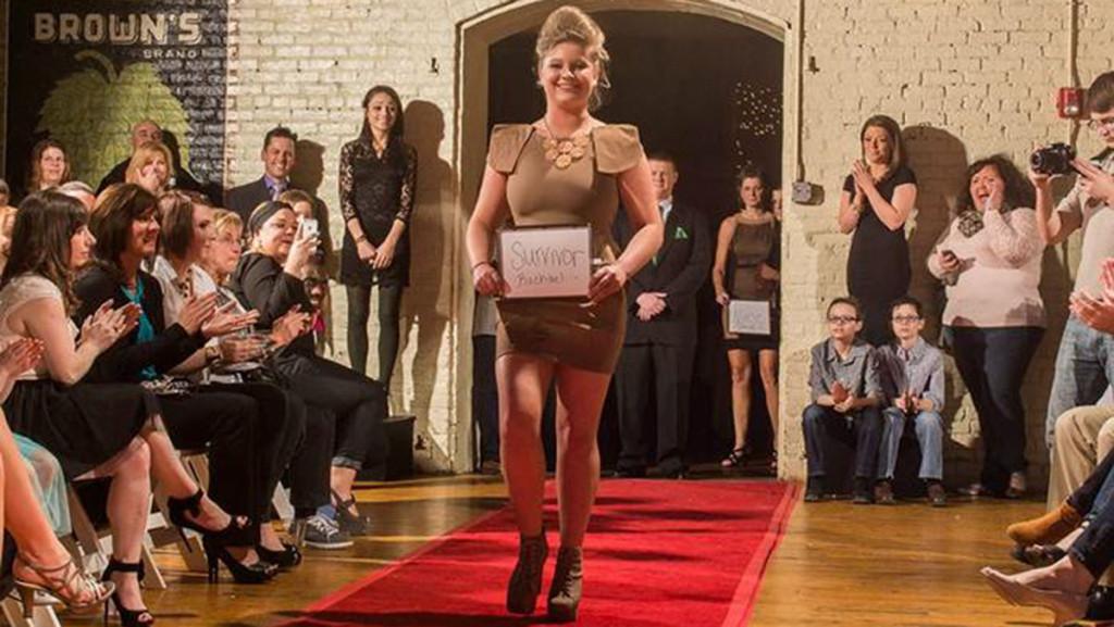 Sophomore Rachael Murray struts down the runway during her 2014 fashion show. The show was put on to raise cancer awareness.