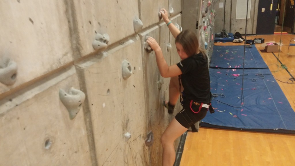 A photo of me climbing at the Ithaca College climbing wall.