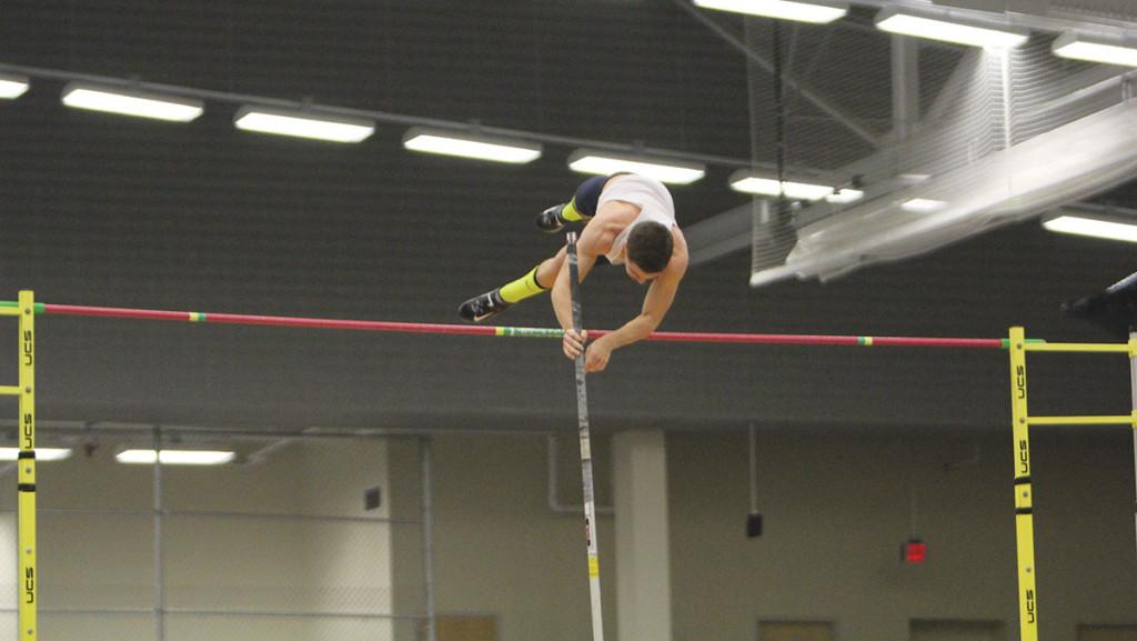 Sophomore Matt Foster leaps over the bar in the pole vault during the Bomber Quad on Feb. 20 at the Athletics and Events Center. Foster finished in fourth place with a height of 4.10 meters.