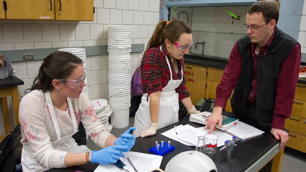 From left: senior Nicolette Czajak, junior Gabrielle Cordaro and David Gondeck associate professor of biology at Ithaca College, working on cryopreserving their bacterial strains.  