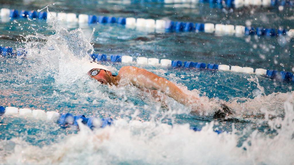 Junior swimmer Adam Zelehowsky swims in the 200-yard freestyle during the Bomber Invitational on Dec. 7, 2014 at the Athletics and Events Center. Zelehowsky finished the race in a time of 1:42.46.
