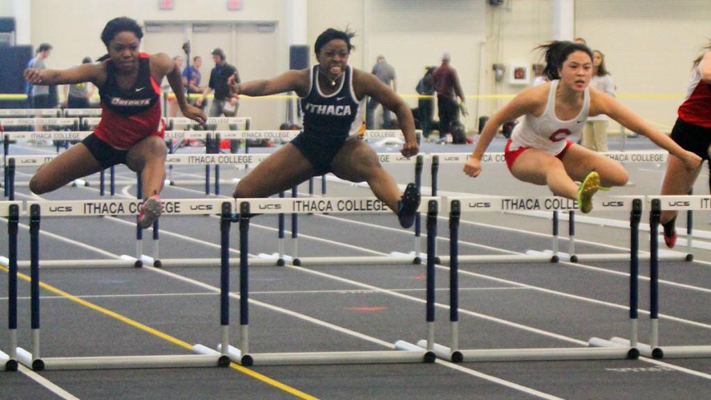 Freshman sprinter Amber Edwards leaps in the air during the 60-meter hurdles in the Ithaca Invitational on Feb. 7 in Glazer Arena. Edwards placed third in the event with a time of 9.46.