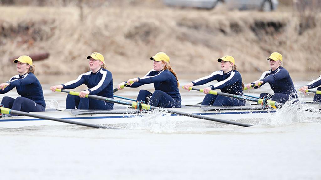 Members of women’s crew race in the Blue and Gold’s regatta against the University of Rochester on Feb. 5, 2014, at the Cayuga Inlet.