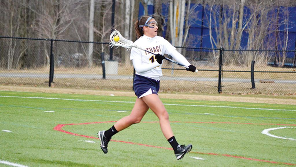 Senior midfielder Niki Standera looks for an open teammate in the women’s lacrosse team’s 9–6 victory over William Smith College. Standera earned all-conference honorable mention last year.