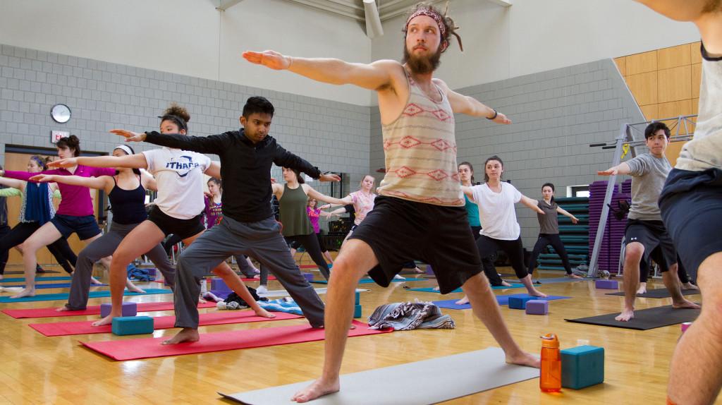Junior Zack Samuels poses among a yoga class Feb. 24 in the Fitness Center.