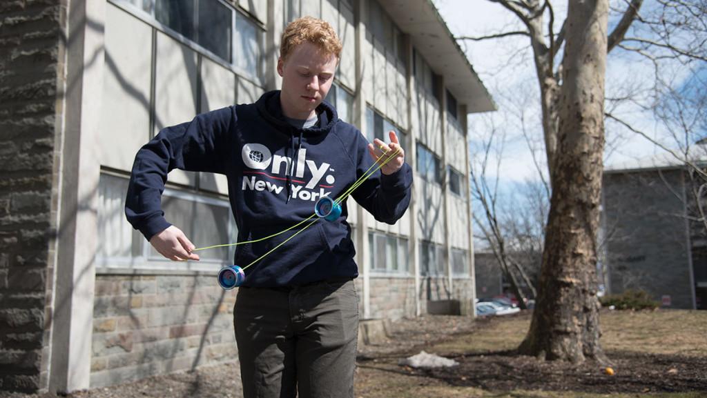 Freshman Donald Hodgkinson practices some of his signature yo-yo tricks.