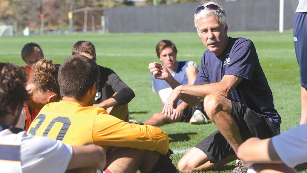 Men’s soccer head coach Andy Byrne addresses his team after the Bombers’ game against Elmira College on Oct. 12, 2013. Byrne is retiring after 31 years at the helm of the South Hill squad’s men’s soccer program.