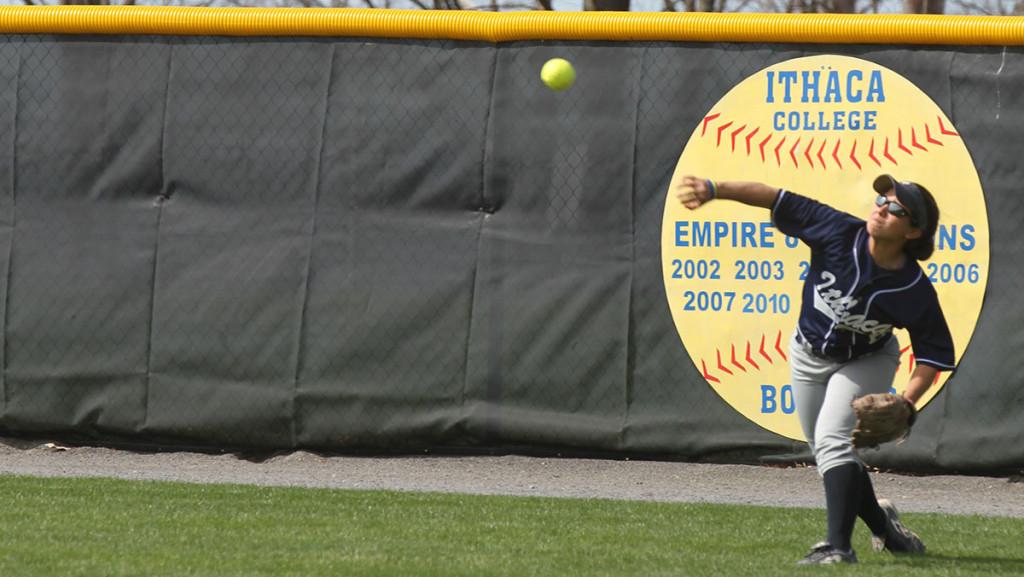 Senior outfielder Nina Lindberg throws the ball back into play after fielding a hit in the softball game against Rensselaer Polytechnic Institute on April 28, 2014. The team owns a 2–6 record this season.                           