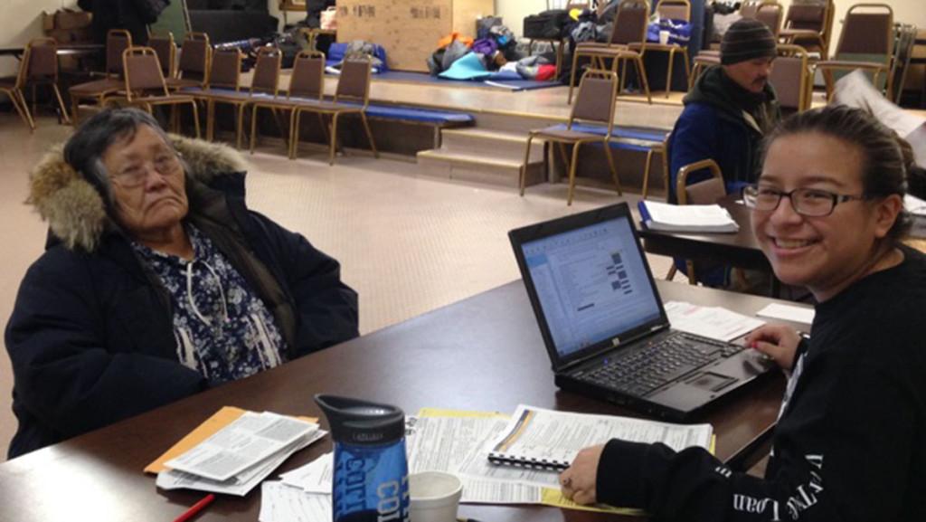  Alice Lainez helps a rural Alaskan villager with her taxes, as part of the Voluntary Income Tax Assistance program during a 10-day trip March 5–14.