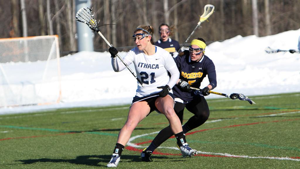 Senior midfielder Molly Fischer executes a spin move in the womens lacrosse teams 14–8 victory over the University of Rochester.