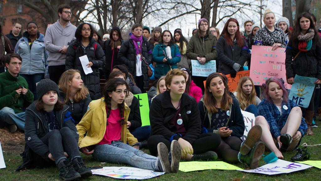 Participants listen to a speaker at Ithaca Take Back the Night on April 24 at Dewitt Park in Ithaca. 