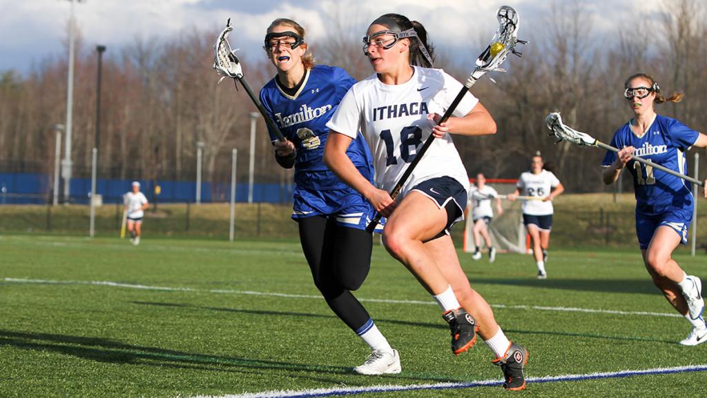 Junior midfielder Riley Marion carries the ball up the field during the women’s lacrosse team’s 9–8 win against nationally-ranked Hamilton College on April 21 at Higgins Stadium. Marion scored three goals on the day.