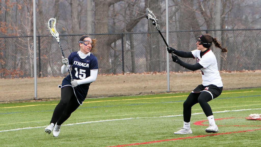 Junior attacker Ally Runyon runs around the net looking to score against a defender during the women’s lacrosse team’s 14–13 double overtime loss against Stevens Institute of Technology on April 2 at Higgins Stadium.