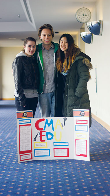 From left, CMA EDU member sophomore Adriana Clark-Sevilla and junior members Adriaan Schiltkamp and Stefanie Tanaka pose April 7. 