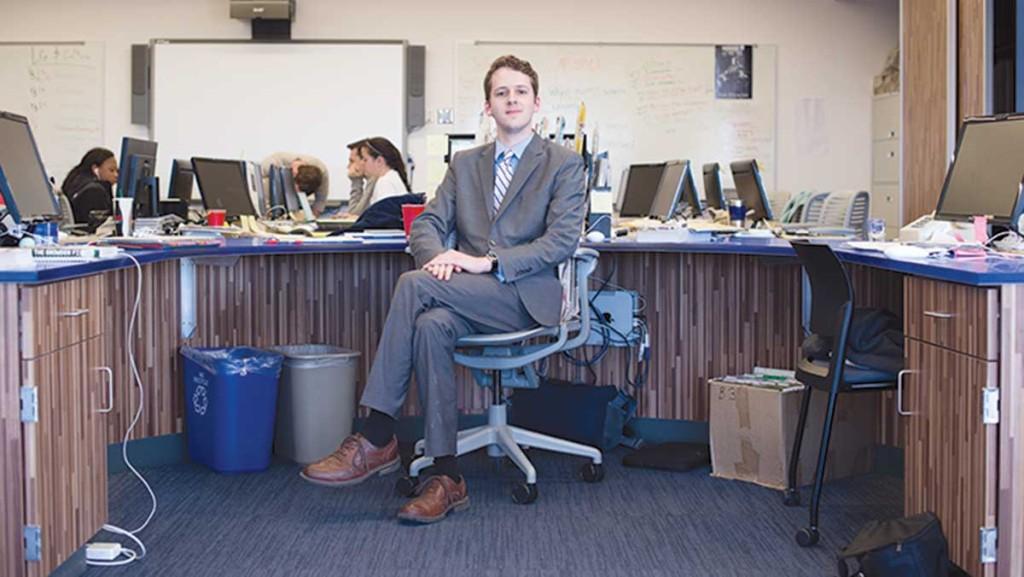 Senior Jack Curran sits at his desk as editor-in-chief of The Ithacan. Curran conducted research on digitial news outlets and their revenue strategies.