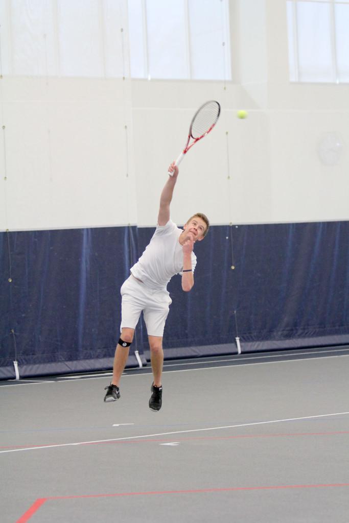 Freshman tennis player Jack Melhorn returns a serve in the men’s tennis team’s 9–0 victory over Alfred University on March 22. Melhorn has earned the Bombers’ No. 1 singles spot as a first year. Caitie Ihrig/The Ithacan