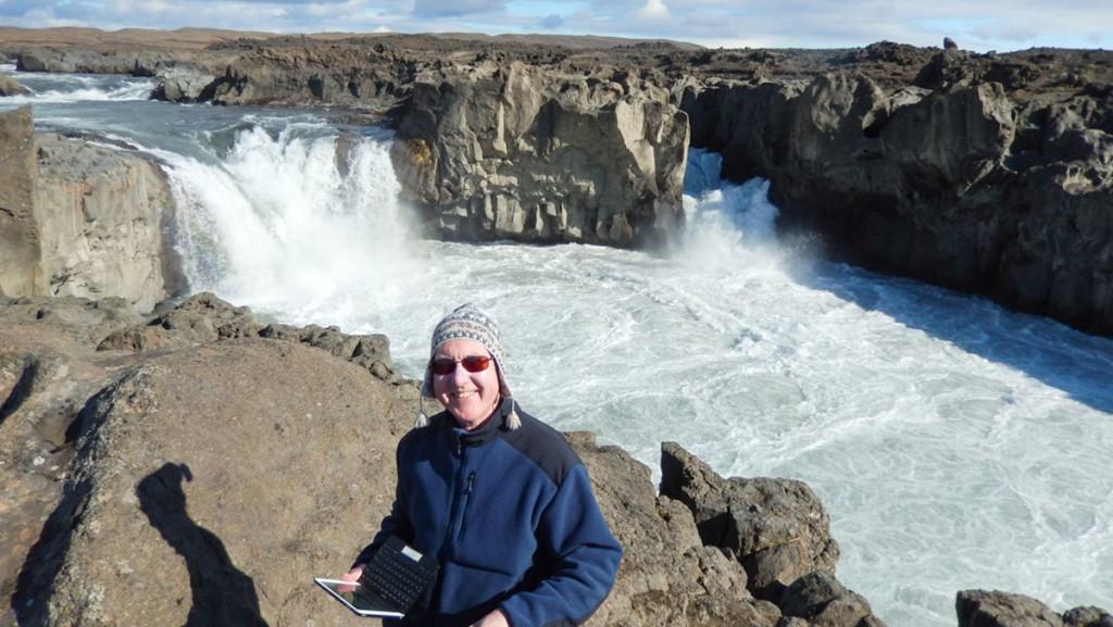 Professor Michael Twomey stands in front of Aldeyarfoss, a large waterfall in Bardardalur, Iceland.